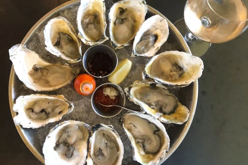 Located in Vineyard Haven, Beach Road is a relative newcomer, open since 2015, but as the sister to the well-established and well-regarded State Road in West Tisbury, its pedigree is impeccable with a focus on modern American fare. With its enormous windows overlooking Lagoon Pond and maritime décor, you might feel like you’ve set sail. Show up at 5 p.m. to enjoy an hour of buck-a-shuck oysters, then settle in for dinner. Dishes like pan-roasted sea scallops and caviar, mussels, lobster and more please seafood fans, but meat-lovers will find pork chops, fried chicken and short ribs. There’s also a small market in the front of the restaurant selling homemade chocolates, granola, coffee, popcorn and other treats.