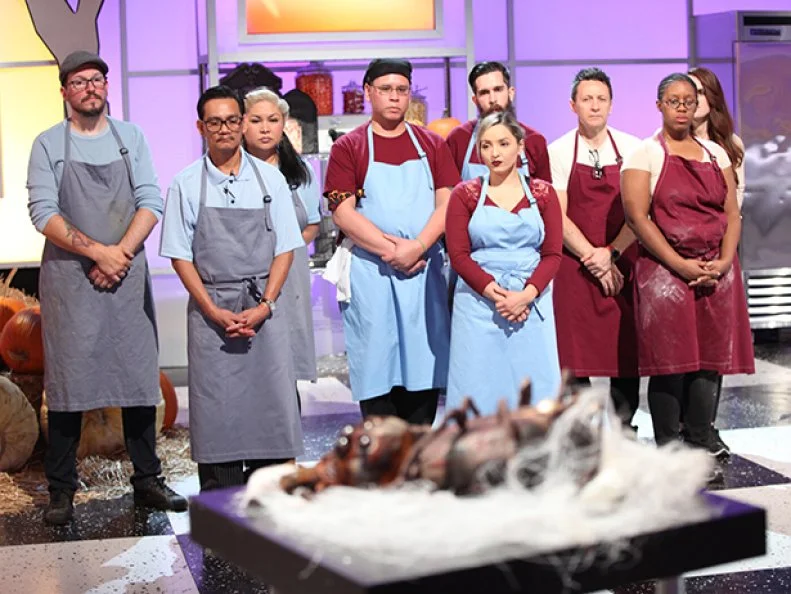 The teams await the judges to critique their creations. Spider-Monkey in the foreground , as seen on Halloween Wars, Season 8.
