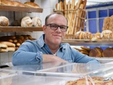 Host Tom Papa poses at Gian Piero Bakery, as seen on Baked with Tom Papa, Season 1.