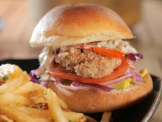 <p>Rebel Kitchen brings international soul food to beautiful Kealakekua with a menu that includes a selection of creative burgers, sandwiches, entrees, salads and homemade sauces. While visiting with Triple G, Guy enjoyed the restaurant's Poke Burger and Coconut Curry Ono &amp; Shrimp.</p>