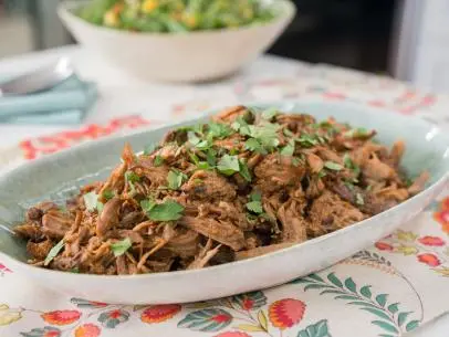 Food beauty of pulled pork sandwiches and peach bbq sauce, as seen on Trisha's Southern Kitchen, Season 12.