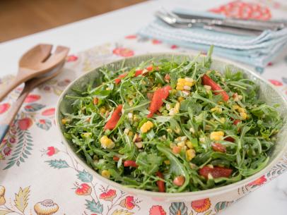 Food beauty sweet corn and roasted red pepper arugula salad with spicy honey dressing, as seen on Trisha's Southern Kitchen, Season 12.