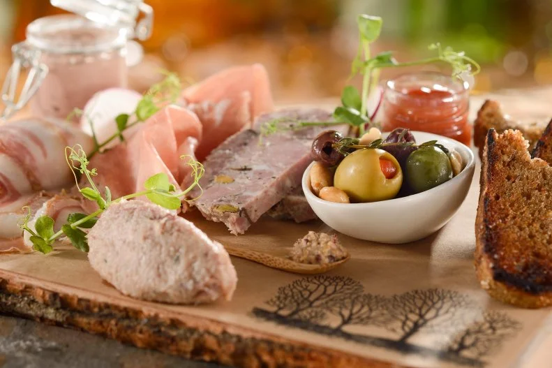 If the Florida sun wears you down, journey to the Pacific Northwest with dinner at Artist Point, which glorifies the best of the region. The charcuterie — including wild boar rillettes — is homemade, and you can bet your salmon will be from waters out that way. As for wines, look for special finds form Oregon and Washington. The more casual Geyser Point Bar & Grill has huckleberry punch and dishes like shrimp on a wire, with miso-lime vinaigrette and chile aïoli.