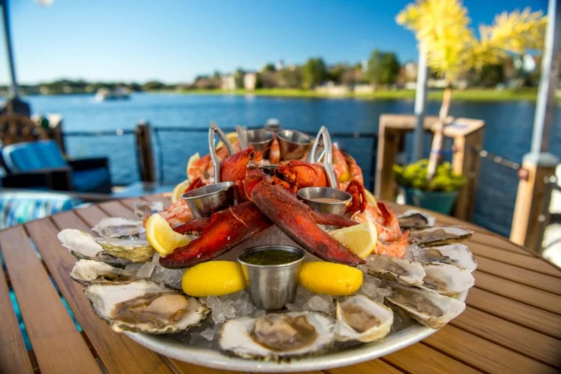The Boathouse stands out for its serious devotion to all things fresh and finny or shelly – well, that and rides in the vintage “amphicars” (amphibious cars) waiting right outside. The raw bar has as many as 14 varieties of oysters at a time, ensuring the right amount of brine for any seafood fan. During stone crab season, the crew creates a dramatic-looking platter to order that turns heads of envious diners. Swordfish steak, coconut-fried shrimp and New England lobster rolls are among the from-the-sea options. For a finale, order the signature S’mores Baked Alaska for the table.