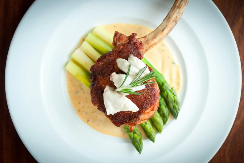 It can be hard for a steakhouse to stand apart, but Bull & Bear at the Waldorf Astoria is far more creative than its Orlando peers. Its chefs are an innovative bunch, carving the bone of a 38-ounce, 32-day dry-aged steak for two, for instance, to look like a tomahawk – and then serving it with a gravy boat full of seasoned beef fat that’s made into a candle and subtly re-liquefied at the table before the chop is served. Feast on a luxury item like foie gras with bourbon caramel, or have your gnocchi laced with basil-fed snails. The veal Oscar may be vintage, yet preserved lemon keeps it contemporary. Old-time gracious tableside service makes this restaurant an especially welcome respite from the parks.