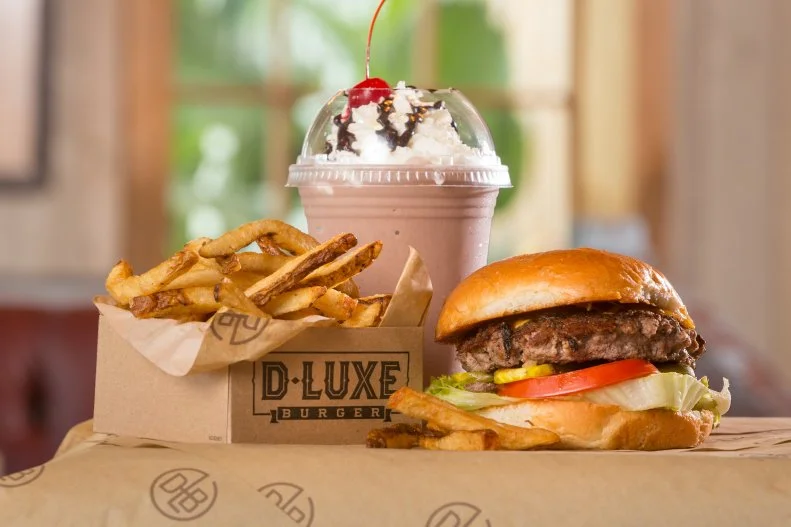 If you visit Disney Springs for the shopping or entertainment, grab a very decent bite at one of Disney’s own quick-service restaurants. The burgers are surprisingly satisfactory, plain or with creative toppings, at D-Luxe Burger, a friendly, air-conditioned spot where a call for “Next neighbor!” means it’s your turn to order; at the register get a frosty shake or IPA too. Add on fries there, or make a meal of fries – preferably the mushroom-topped French variety – at The Daily Poutine, featuring four thick-cut takes on the Canadian specialty. For a little ooh-la-la, get a hand-held ham-and-cheese crepe at AristoCrepes. The salted-caramel bubble waffle will feed three sweets-lovers. Speaking of sweets, Amorette’s Patisserie is the real deal. While the domed Mickey Mousse is Instagram-worthy, we adore the chocolate specialties, especially the Sunday Coffee Pastry with Bailey’s and espresso mousses plus caramel sauce.