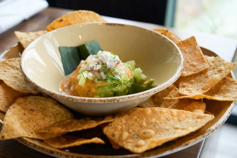 Chicago can claim Mexican cuisine expert Rick Baylessâ   fiery fare, but Orlando gets a taste, too, at Frontera Cocina. Though many diners may be wearing mouse-ear hats, theyâ  re eating food thatâ  s supremely south of the border. Unwind with a blood orange-jalapeno margarita, rimmed in chile, along with a helping of Atomic guacamole with habanero salsa. Then dig into a richly flavored shrimp mojo de ajo, or the vegetarian zucchini, mushroom and potato enchiladas with roasted tomatillo sauce.