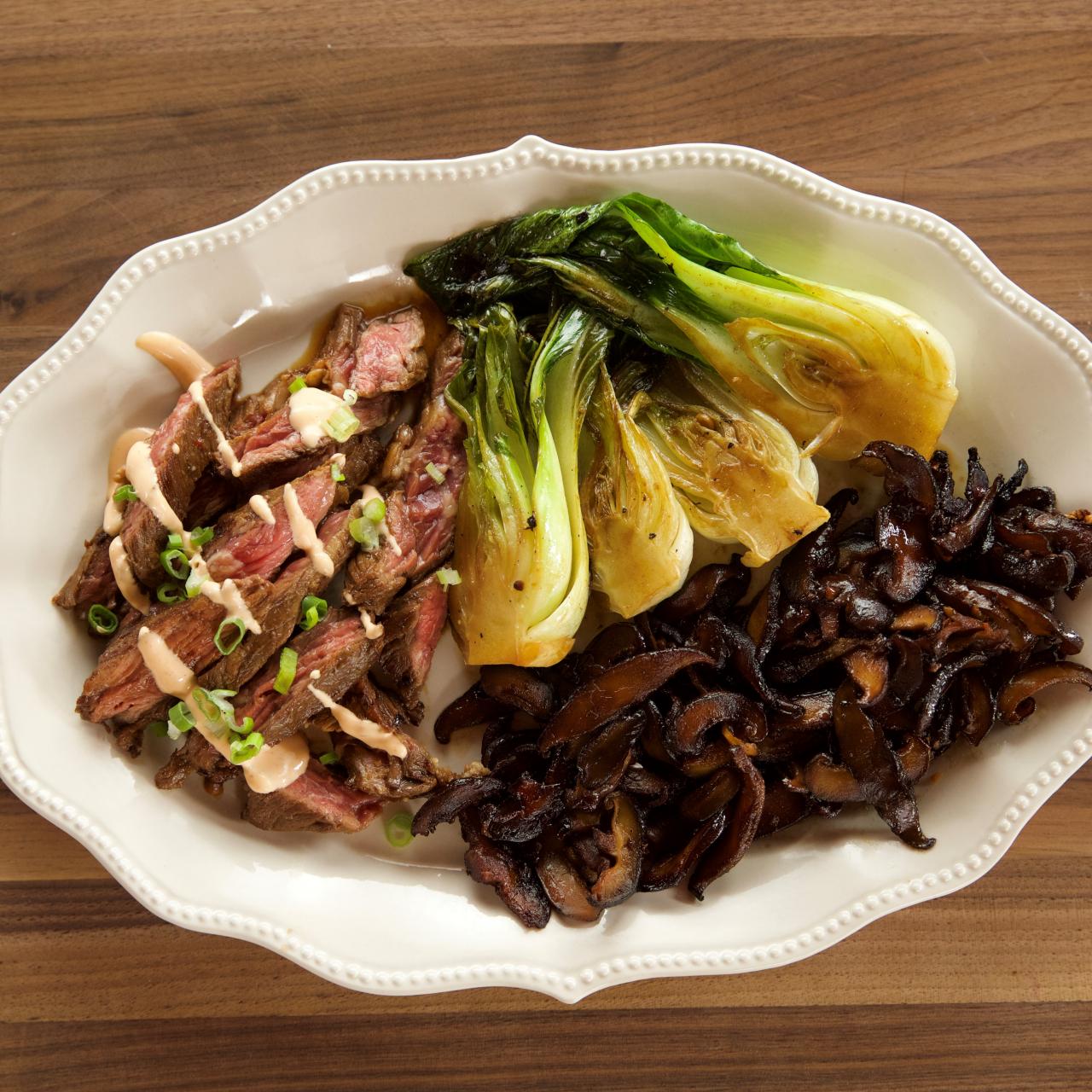 https://food.fnr.sndimg.com/content/dam/images/food/fullset/2018/8/15/0/WU1911_Skirt-Steak-with-Bok-Choy_s4x3.jpg.rend.hgtvcom.1280.1280.suffix/1534345661444.jpeg