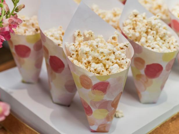 Katie Lee makes Pink Lemonade Popcorn and Geoffrey Zakarian makes DIY popcorn cones, as seen on Food Network's The Kitchen 