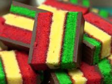 At Gian Piero Bakery in Queens, New York, the layers of a rainbow cookie aren't just colorful, they're flavorful. The red layer is strawberry, the green is pistachio, sandwiched around the plain white layer with a layer of raspberry Jam, as seen on Food Network's Baked, Season 1