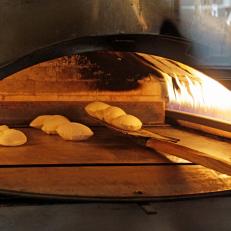 Pita bake and puff in a thousand degree oven at Al Ameer, a Middle Eastern restaurant in Dearboen, Michigan, as seen on Food Network's Baked, Season 1.