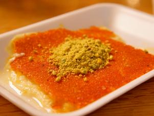 Kunafa is a traditional Middle Eastern treat made with a delicate semolina dough, fresh cheese and sugar syrup.  It's the most popular dessert at Masri Sweets in Dearborn, Michigan outside of Detroit, as seen on Food Network's Baked, Season 1.