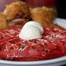 Spicy fried chicken is the perfect pairing with a giant red velvet waffle at Kuzzo's Chicken and Waffles in Detroit, as seen on Food Network's Baked, season 1.