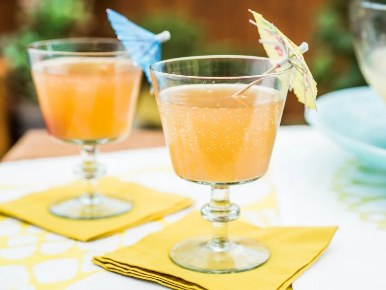 Sunny Anderson and Jeff Mauro make a Sparkling Pina Colada Punch, as seen on Food Network's The Kitchen