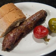 Santarpio's Pizzas' sausage and peppers with Santarpio's bread, as seen on Baked With Tom Papa, Season 1.