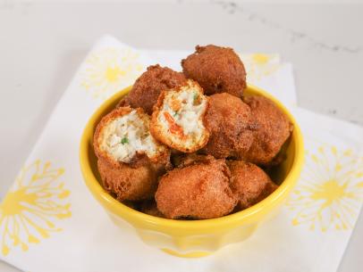 Crab Stuffed Hush Puppies, or Crush Puppies, are displayed, as seen on Let's Eat, Season 1.
