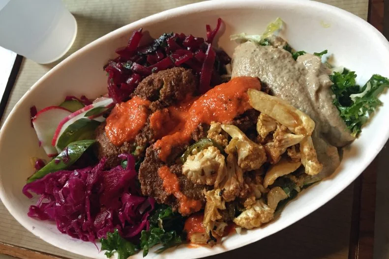 This quick-service restaurant in the Short North neighborhood may be named after a vegetable, but you’ll still find plenty of meat on Brassica’s menu. The spot caters to carnivores and veggie lovers alike with an array of Lebanese-inspired options. The menu allows for almost infinite customization. Choose from meats, falafel, complimentary sauces and vegetables, of course, to mix in a salad bowl or stuff into pita bread. Meat options include brisket, chicken and glazed bacon, while the veggie lineup encompasses cucumbers, radishes, beets, pickled red cabbage, marinated eggplant, cauliflower and spicy carrots. Brassica has proven to be so popular that there’s often a line out the door, but it does move briskly.