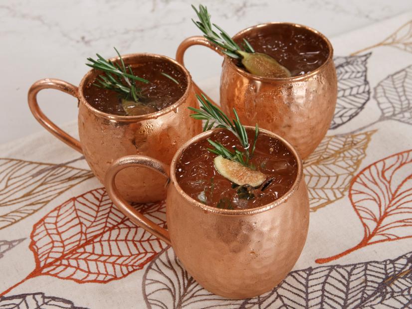 The Fig and Rosemary Mule cocktail is displayed, as seen on Let's Eat, Season 1.