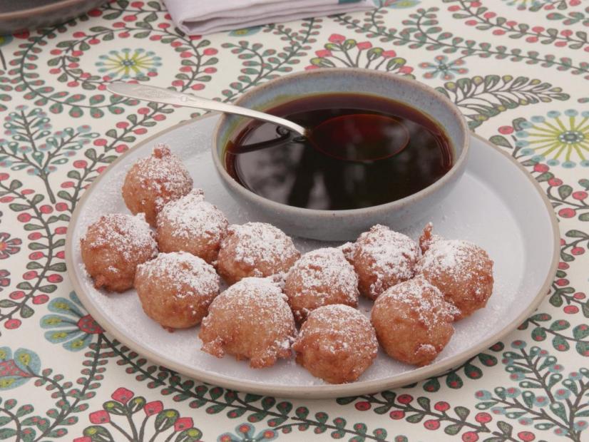 A plate of Hot Calas, topped with powdered sugar and served with cane syrup, Louisiana style as seen on Cajun Aces, Season 2.