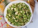 Katie Lee makes Shaved Brussels Sprout Salad with Dates, Manchego, and Almonds, as seen on Food Network's The Kitchen 