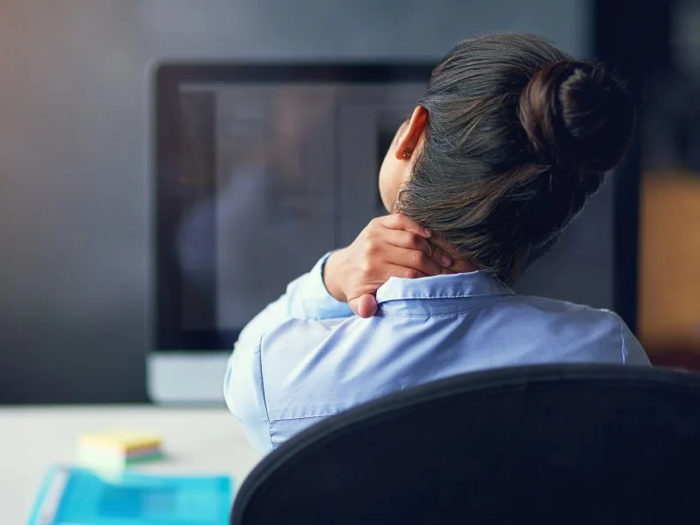 Rearview shot of a businesswoman suffering from neck pain at the officehttp://195.154.178.81/DATA/i_collage/pi/shoots/806127.jpg