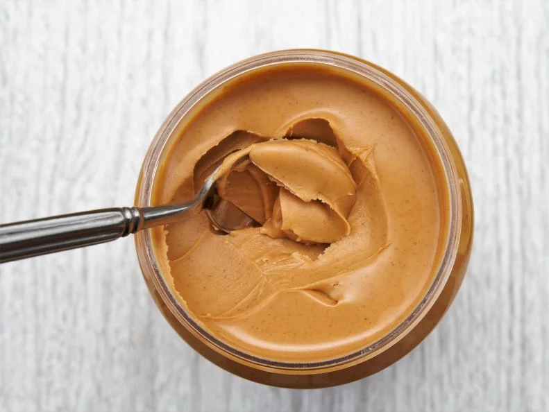 Peanut butter snack. Spoon in a jar of peanut butter.