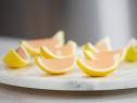 Chef Vivian shares her over the top pregame lemon gelatin shots, made with a gelentin center mixed with titos vodka, as seen on Food Network Lets Eat Episode 109.