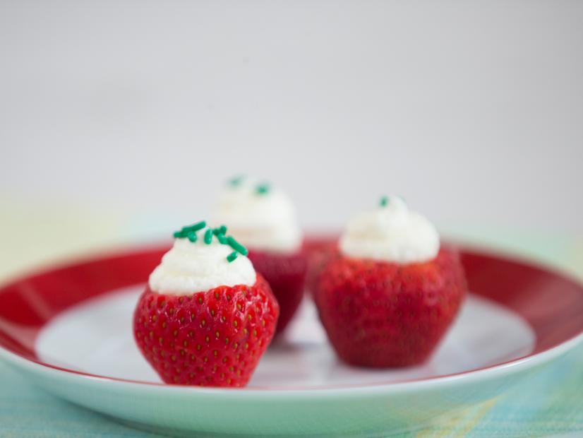 Chef Vivian shares her strawberry daiquiri shots recipie with the host, which is fun quick and easy. Strawberries are cut open leaving a small hollow hole which is filled with a strawberry daiquiri gelatin mix and topped with whip cream and green sprinkles, as seen on Food Network Lets Eat Episode 109.
