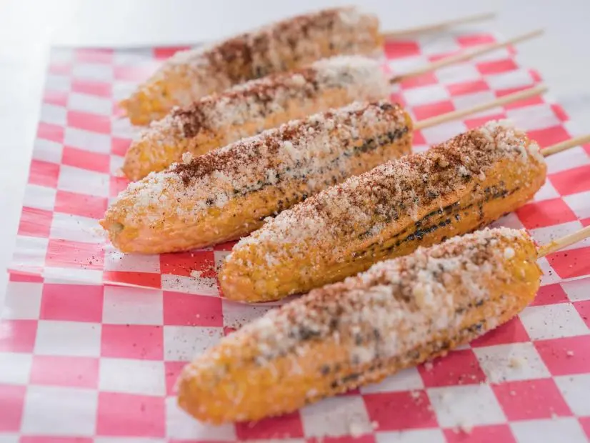 Food beauty of roasted corn on a stick, as seen on Trisha's Southern Kitchen, Season 12.
