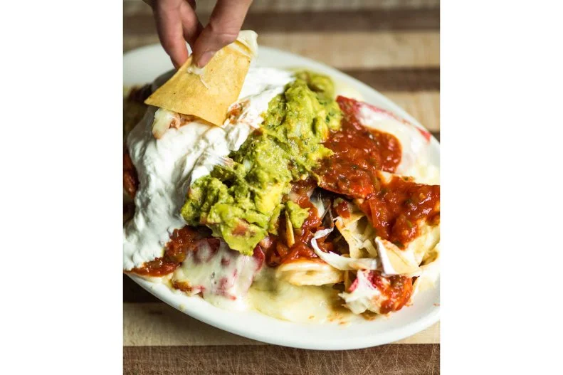 In 1980, when the Brick Alley Pub opened in Newport, it was the first restaurant in the area to tantalize its guests with nachos. Little has changed. Between peeping at mansions, many Newport visitors find themselves beside locals at this icon, unwinding with a Rhode Island-brewed beer and a plate of the Ultimate Nacho Platter. Bursting with salsa, cheddar-Jack, refried beans, guacamole and sour cream, it’s a satiating way to refuel before hitting the Cliff Walk.