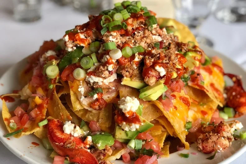 Although less well-known than its cold, mayo-doused cousin hailing from Maine, the simple, hot-buttered lobster roll is a Connecticut-bred phenomenon. To honor this creation, Chapter One Fine Food & Drink in Mystic makes its nachos with fresh cold-water lobster meat tossed in jerk seasoning, combined with avocado, pico de gallo and goat cheese, and served over housemade tortilla chips dotted with Sriracha.