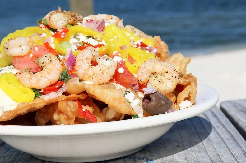 Inspired by his time cooking in Birmingham, where a dynamic Greek community thrives, Gulf Shores chef Chris Sherrill dreamed up a nacho recipe featuring a spinach-feta cream sauce spiked with ouzo. Served at the beach bar and restaurant COASTAL, the dish shuns tortilla chips for wontons and is topped with green olive, chopped tomato, and peppadew and banana peppers, as well as plenty of the sweet shrimp for which the Gulf Coast is famed.