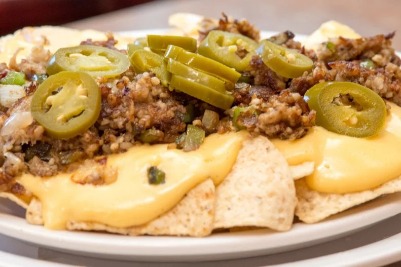 Goetta, the meat-and-oats sausage beloved by denizens of Cincinnati and northern Kentucky, dominates the distinctive nacho preparation at Colonial Cottage in Erlanger. At this Depression-era country-style restaurant with a Sunday buffet, goetta is served atop the tortilla chips brown and crispy, tangled with cheese sauce, bell pepper, sweet yellow onion and jalapeno.