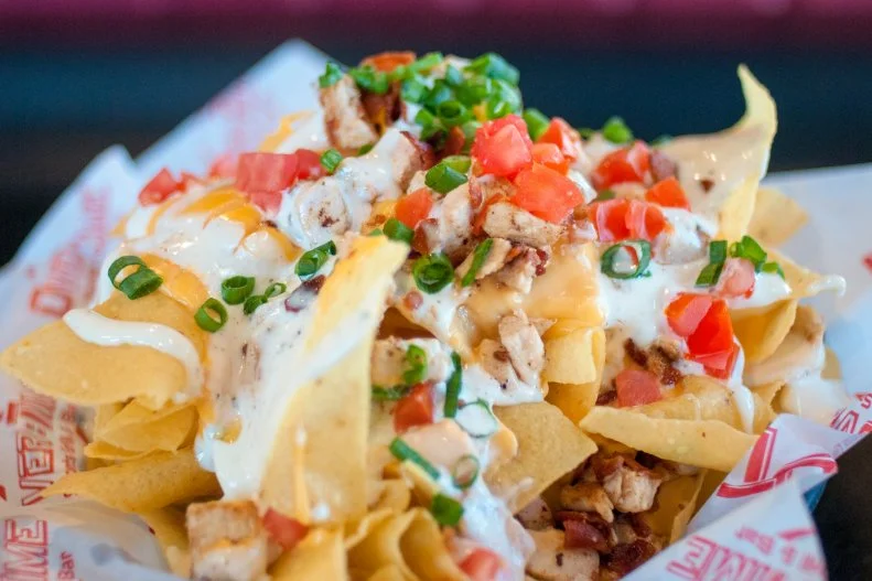 South Dakotans have an affinity for ranch dressing, so it’s no surprise that it’s one of the ingredients in the nachos served at OverTime Sports Grill & Bar in Sioux Falls. The creamy condiment is bolstered by hunks of baked chicken breast, crunchy bacon, cheese, green onion and tomato. Beyond watching the game on $5 Tuesdays, it’s another reason to drop by.