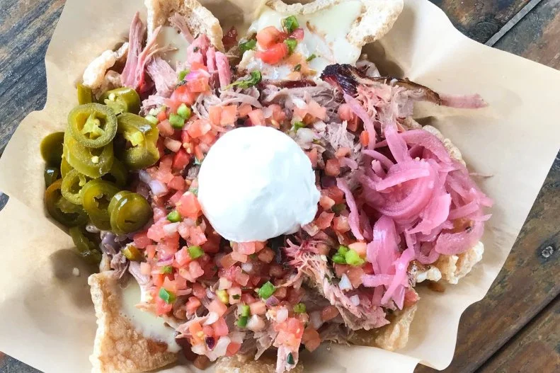 Feasts at the Pig & Pint in Jackson’s Fondren district often call for craft beer, pork belly corndogs and pork rind nachos. Whether pulled pork, smoked chicken or brisket is the meat of choice accompanying those rinds, the nachos are overloaded with queso, smokehouse beans, pickled onion, pico de gallo, jalapeno, sour cream and Mississippi “sweet” BBQ sauce.