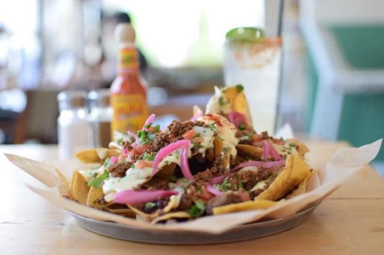 Champions of fresh and local ingredients, The Fold: Botanas & Bar originated as an Austin food truck before taking over a circa-1960 filling station in Little Rock’s Riverdale neighborhood. Among the favorites at this colorful, modern Mexican restaurant with the boisterous patio scene are the nachos. Marrying black beans, habanero queso, pico de gallo, pickled onion, cilantro and crema Mexicana, they are at their finest when loaded with meats like bison or brisket.