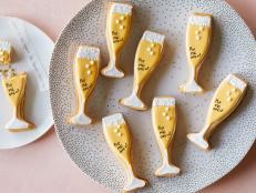 These festive sugar cookies shaped like mini champagne flutes are the perfect sweet treat to ring in the New Year. Whether you are throwing a fancy black-tie affair or a small family dinner, these cookies (with two surprises inside!) will surely be a hit.