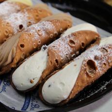 An assortment of cannoli are filled with chocolate and vanilla cream, and classic ricotta cheese at Termini Bros. in Philadelphia a as seen on Food Network's Baked, Season 1.