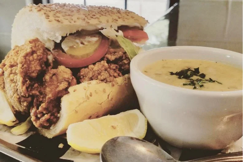 During a violent streetcar strike in 1929, former conductors Bennie and Clovis Martin pledged to feed their old coworkers at their coffee and sandwich stand. The brothers asked baker John Gendusa to fashion a wider loaf to accommodate larger servings for the â  poor boysâ   on strike. The name and the sandwich stuck, becoming part of Louisiana sandwich history. You can get a great poâ   boy nearly anywhere in the state, but New Orleansâ   Bevi Seafood Co. is consistently hailed as one of the best â   their fried oyster poâ   boy features Louisiana oysters fried to juicy and crisp-dressed with lettuce, tomatoes, pickles and mayonnaise on a roll sourced from century-old Leidenheimer Baking Company.