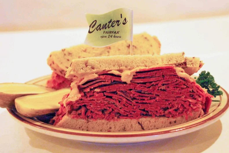 Few dishes showcase the melting pot of American cuisine better than corned beef. Created by wealthy Irishmen, commoditized by the British, adopted by North American colonists and perfected by Jewish immigrants in New York City, brined and boiled brisket has become both a St. Paddy’s Day and Jewish deli staple around the United States. Served hot on fresh baked rye bread with a pickle, Canter’s in Los Angeles is one of the best places to try it. Open 24 hours a day, aside from Jewish holidays, the landmark deli has long been a magnet for celebs at all hours of the day and night, luring Marilyn Monroe and Arthur Miller, Prince, Stevie Wonder and Guns N’ Roses to its vinyl-covered booths.