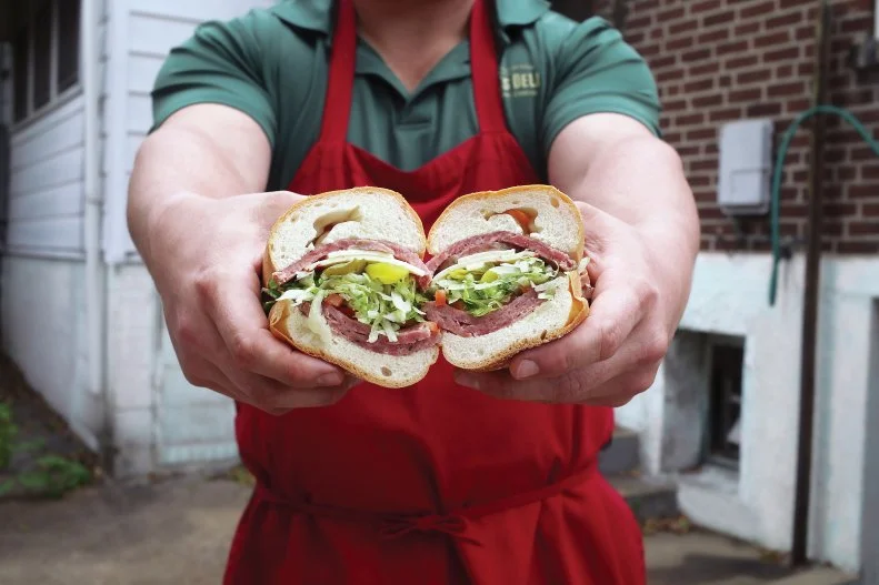 This appropriately titled sandwich is hot in more ways than one. Gioia’s famous hot salami is served warm on Italian bread with Provel cheese and whatever garnishes are desired. And it’s been hailed as St. Louis’ favorite sandwich since 1918. House-made salame de testa is boiled from-scratch every day from a mix of beef and pig parts (that ends up more like a terrine or pate than your run-of-the-mill salami. The slightly earthy and peppery meat is sliced to order in thick rounds, served on hot Italian bread (get the garlic-cheese bread) dressed with choice of toppings like lettuce, tomato and spicy giardiniera.
