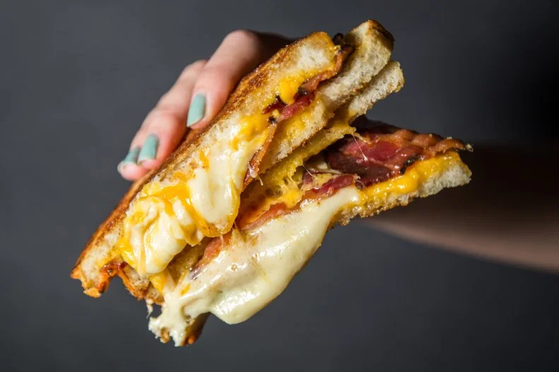 Making a good grilled cheese is actually harder than it seems. Every home cook has experienced the blackened bread or not-fully-melted cheese problem. Those sad attributes are never an issue at Melt Shop, arguably the place that reinvented the grilled cheese. Whimsical sandwiches span from pepper Jack-coated Buffalo chicken to savory French onion steak. Purists appreciate the simple Maple Bacon. A superior version of the homemade bacon-topped version, Melt Shop’s take combines sweet maple-glazed bacon with New York cheddar and sharp brick spread, perfectly gooey on properly browned country white bread.