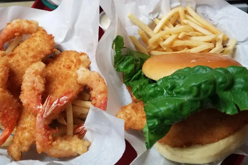 Fried fish sandwiches are popular all across America, at fast food joints, oyster bars and seafood shacks up and down both coasts. Itâ  s hard to find a fresher â   or better â   fried halibut sandwich than the one served at Varlyâ  s Swiftwater Seafood Cafe in Whittier, Alaska. It features fish harvested straight from the Prince William Sound, hand-dipped in a secret recipe batter. The result is a perfectly golden, tender filet nestled into a springy bun. These are best enjoyed on the restaurantâ  s covered deck, which offers prime views of the mountain-backed harbor.