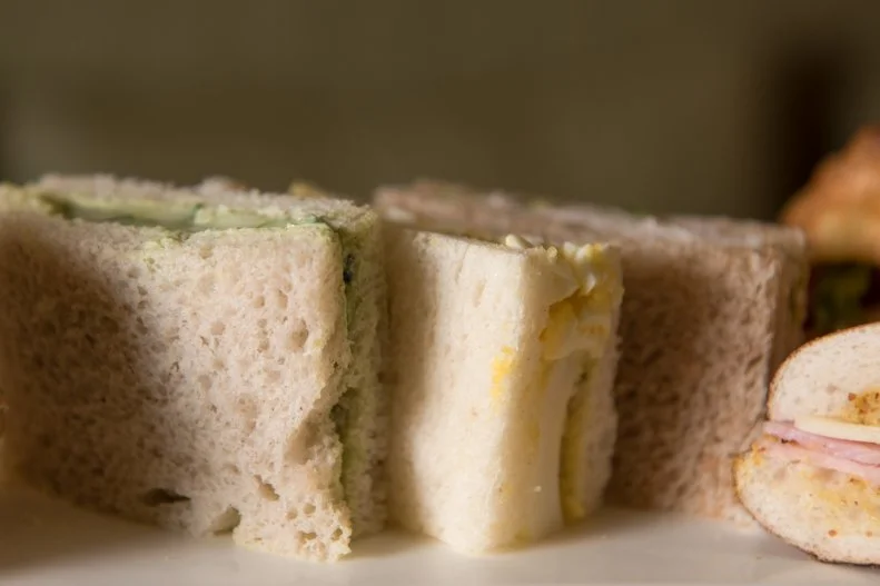 Back in 19th-century Britain, it was considered fashionable to eat dinner at 8 p.m. To mind the long gap between luncheon and evening meal, Anna Maria Stanhope, seventh Duchess of Bedford, came up with the ingenious idea of afternoon tea service. To this day, the elegant snack usually includes a light sampling of cakes and scones served with cream and jam as well as a selection of light sandwiches. The most-famous of the array is the cucumber sandwich, immortalized by Oscar Wilde, and enjoyed by guests at places like The Plaza Hotel’s storied Palm Court. There, English cucumber is flavored with minted goat cheese Green Goddess on crustless rye bread on a tier with other sandwiches and savories.