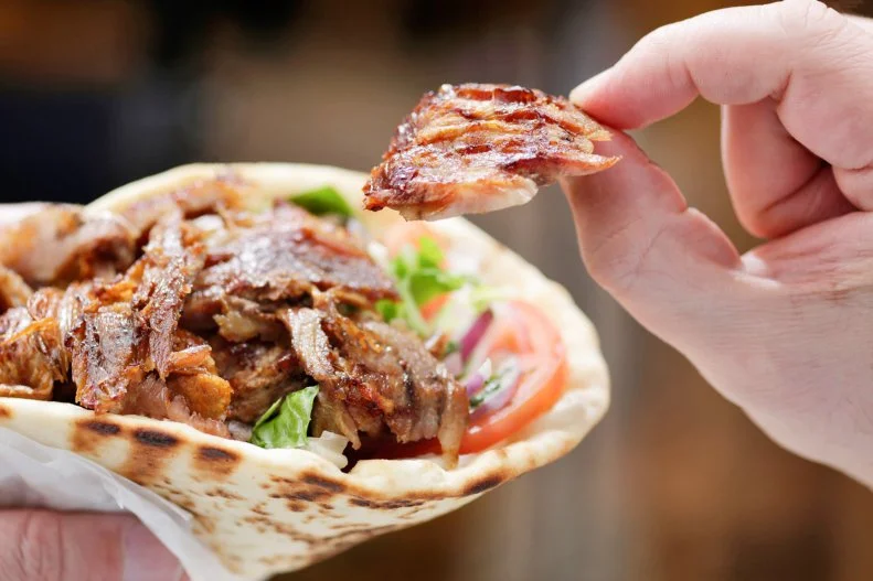 Imported from the Ottoman Empire to Greece, then from Greece to America, the gyro features thin slices of meat, stacked onto a skewer, slowly churned on a vertical spit. Those juicy hunts are sliced off into thin slivers and stuffed in a pita with tomatoes, onions and lettuce and creamy, refreshing tzatziki sauce. Sadly, there are a lot of bad gyros out there in the world, made from processed slices of mystery meat and ready-made sauce. Find a banner version at BZ Grill. The Astoria restaurant makes its gyro the right way, with sliced-to-order shards of succulent pork served on fluffy toasted pita with all the traditional fillings and fresh tzatziki, tangy from yogurt and brimming with herbs.
