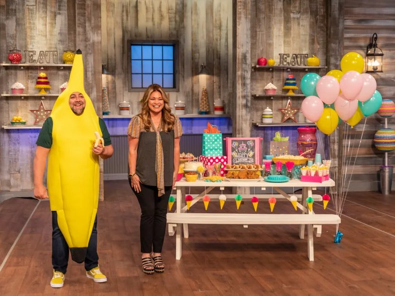 Hosts Valerie Bertinelli and Duff Goldman announce the twist for the main bake, bananas, as seen on Kids Baking Championship, Season 5.