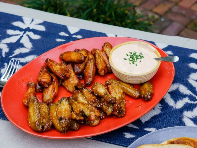 Trisha’s Sticky Sesame and BBQ Bourbon Wings with Sriracha Ranch, as seen on Trisha’s Southern Kitchen, Season 13.