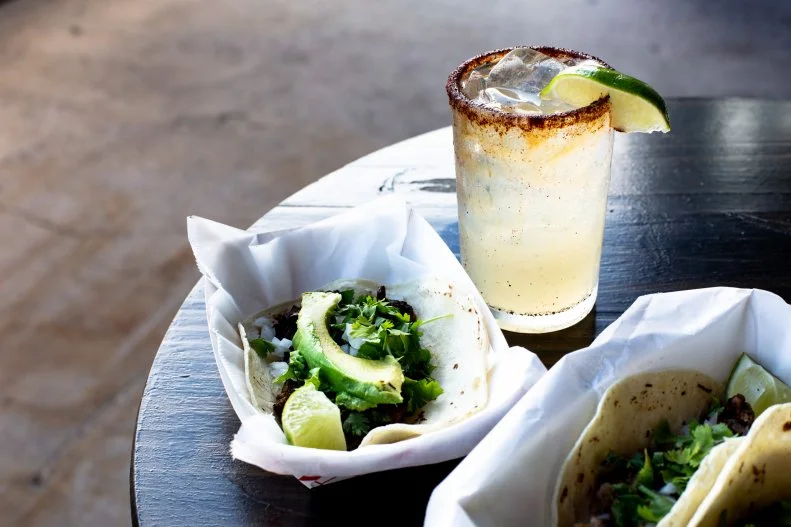 This onetime taco truck turned brick-and-mortar spot keeps things simple with a menu of taco-house essentials tacked to the wall and tubes of housemade red and green salsa on the bar tops. At $2.50 a pop, asada and smoked pork tacos are a bargain even with add-ons like creamy chunks of avocado or beans, and the $4 mango slushie should most definitely be amped up with a shot of tequila.