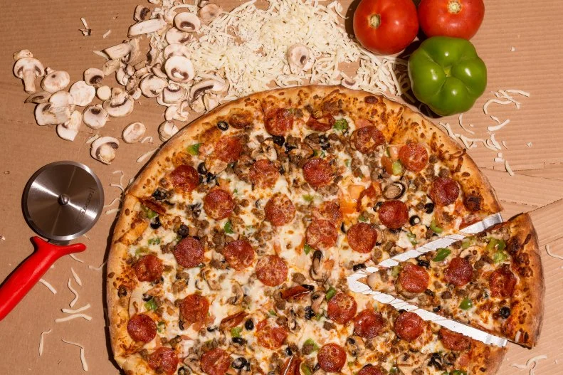 Its late-night hours and proximity to Main Street's lively bar scene have made this no-frills pizza parlor a watering hole for Downtown partygoers — even more so with the recent addition of Frank's Backyard, the two-level open-air bar next door, which offers a spirits menu and more than 40 beers on tap. A wait in line is almost always guaranteed, not because a monster Hawaiian slice with chunks of sweet pineapple will most definitely hit the spot after a half-dozen Jagerbombs, but because the pizza is truly among the best in the city. A good old-fashioned New York-style slice of plain cheese pizza — thin and malleable at the tip, leading to a thick and crispy crust — is under $3 here and always hot and ready at the counter.
