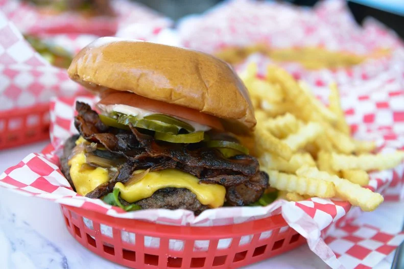 At famed pitmaster Ronnie Killen's 1950s-style diner in Pearland, burgers are piled high with traditional toppings between fluffy potato buns and tightly wrapped in paper pockets to ensure minimal spillage. The off-the-menu cheeseburger basket is a steal here; for $7, it delivers a wagyu beef cheeseburger with all the fixins, Killen's staple crinkle-cut fries and a beverage. Adding on a 44 Farms all-beef dog or an order of crisp, golden hand-battered onion rings may be tempting, but save room for dessert. Killen's handspun apple pie milkshake is thick, creamy and finished off with a generous drizzle of pie crumble and warm cinnamon spice.